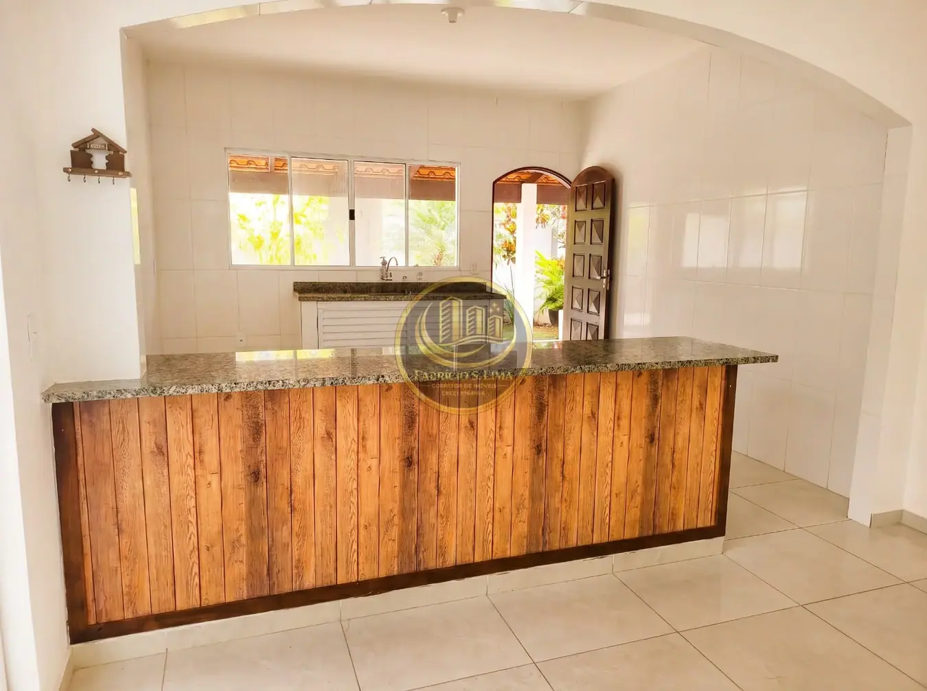 Sala integrada à cozinha — casa em Cibratel II